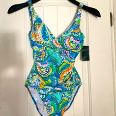 Slimming Fit, Beautiful Colors With Golden Details. Never Worn. Size 4 Multicolor Fitted V-neck Swimwear, Multicolor Sleeveless Swimwear With Vibrant Print, Vibrant Sleeveless Swimwear For Spring, Vibrant Sleeveless Spring Swimwear, Fitted Multicolor One-piece Swimwear, Patterned Sleeveless Spring Swimwear, Fitted Multicolor V-neck Swimwear, Multicolor Lined Swimwear For Beach Season, Green Swimwear With Vibrant Print For Pool