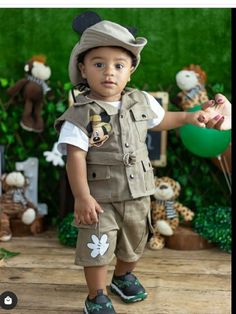 a little boy dressed up as mickey mouse