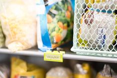 a grocery store shelf filled with lots of food and bags on top of it's shelves