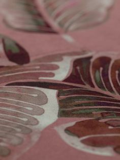 a close up view of a pink and green floral pattern on a bed sheet that has been made to look like something out of fabric