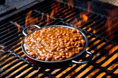 baked beans are cooking on the grill