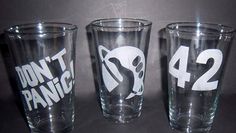 three shot glasses with the number 42 on them