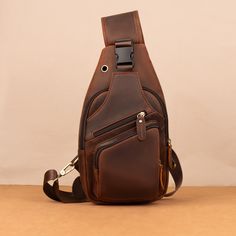 Crazy Horse Leather Chest Bag for Men's Leisure Retro Style Crossbody Bag Top Layer Cowhide Shoulder Bag Commuter Outdoor Leisure Bag PRODUCT INFORMATION --------------------------------------------- --Product Size: 34x9x17 cm--13.38x6.69x3.54 inch; --Item Weight:0.6 kg/1.32lb --Color: Deep Brown --High-Quality Stitching This bag has an adjustable shoulder strap. On the back of the crossbody bag are two hooks for both the left and right shoulders The ultimate grab-and-go daypack, this brown leather crossbody bag is built to be an upgrade on overstuffed pockets. It's made from genuine full grain buffalo leather, the highest grade available. That means the very top layer of the hide only is used. Buffalo leather is the strongest and thickest type available. This gives it the longest durabili Brown Multifunctional Portable Shoulder Bag, Brown Multifunctional Shoulder Bag, Shoulder Chest Bag For Outdoor Activities, Portable Chest Bag Satchel For Travel, Brown Mobile Phone Bag For Outdoor Activities, Portable Brown Satchel Chest Bag, Durable Casual Business Bags, Portable Shoulder Bag For Everyday Carry, Rectangular Chest Bag For Outdoor Activities