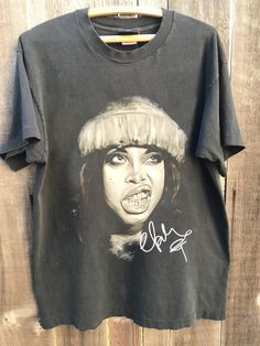 Erykah Badu Tour 2024 Tshirt, Erykah Badu vintage, music t-shirt Gift for men, women Unisex T shirt Comfort color ABOUT MATERIAL: Comfort Colors® 1717 Made with medium fabric (6.1 oz/yd² (206.8 g/m consiting of high quality, 100% ring-spun US cotton for long-lasting comfort. The relaxed fit keeps the wearer comfy in both casual and semi-formal settings while the crew neckline delivers that classic, neat style which makes it perfect for accessorizing. What's more, the pre-shrunk fabric ensures a Vintage Short Sleeve T-shirt For Music Festivals, Vintage Sublimation Print T-shirt For Streetwear, Vintage T-shirt With Sublimation Print For Streetwear, Band Merch T-shirt With Vintage Print, Band Merch Short Sleeve T-shirt With Vintage Print, Grunge T-shirt With Vintage Print In Relaxed Fit, Grunge T-shirt With Vintage Print And Relaxed Fit, 90s Vintage Print Black T-shirt, Hip Hop Style Short Sleeve T-shirt For Music Festivals