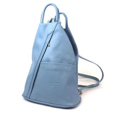 Features: Measurements: 31cm x 26cm x 13cm Handmade from Genuine Italian Leather Front Zip and Slip Pockets Back Zip Pocket Inside Zip Pocket Silver Zipper Adjustable Straps - Can be worn as a Sling Bag Adaptable Elegance: This backpack offers you the freedom to wear it your way. Carry it as a sling bag or the classic backpack - it effortlessly adjusts to your needs and mood. Smartly Organised: With inside zip pocket your essentials remain neatly organised. Plus, the front and back zip pockets and front slip pocket add extra space for quick access to your belongings. Your Choice of Shade: With a spectrum of captivating colours, you can express your individuality and match your bag to your outfit. From bold and vibrant to timeless and classic, there's a shade for every style. Built to Last: Modern Blue Leather Backpack For Everyday, Modern Everyday Blue Leather Backpack, Light Blue Travel Backpack, Blue Rectangular Leather Backpack With Adjustable Strap, Blue Leather Backpack For Daily Use, Blue Leather Travel Backpack, Modern Blue Leather Backpack With Adjustable Strap, Modern Blue Leather Backpack For Travel, Modern Blue Leather Travel Backpack