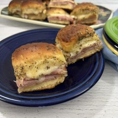 ham and cheese sliders on a blue plate