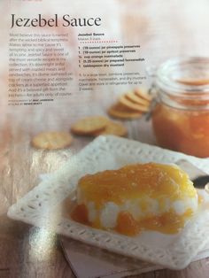 an article in the magazine about jezebel sauce on a plate with crackers