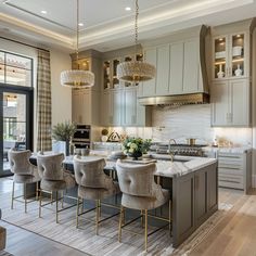 a kitchen filled with lots of counter top space next to a dining room table and chairs