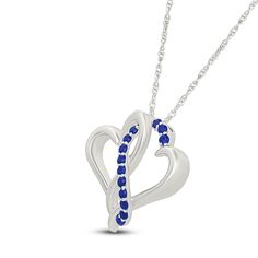 Two hearts collide in the prettiest way in this sweet and shimmering necklace. Sterling silver Two open hearts are entwined in the polished pendant Along the center, a curved ribbon of round blue lab-created sapphires shines 18-inch rope chain; spring ring clasp Sapphire Heart Pendant Jewelry For Valentine's Day, Anniversary Sapphire Jewelry With Heart Charm, Sapphire Heart Pendant For Anniversary, Sapphire Heart Pendant Necklace In Sterling Silver, Sapphire Sterling Silver Heart Pendant Necklace, Sterling Silver Heart Cut Sapphire Necklaces, Sterling Silver Sapphire Heart Cut Necklaces, Sapphire Jewelry For Valentine's Day, Heart Cut Sapphire Sterling Silver Necklaces