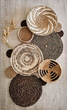 several woven baskets are arranged on the floor