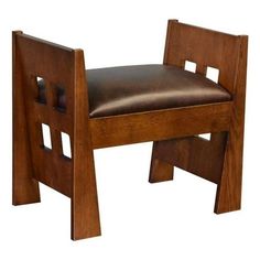 a wooden chair with leather seat and back rest