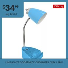 a blue desk lamp sitting on top of a table next to a box with an empty container