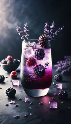 a glass filled with ice and berries on top of a table