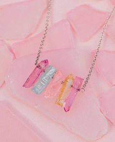 Wanna instantly brighten up any outfit? Then toss on our Rainbow Crystal Necklace! Set on a classic silver chain, this style features five quartz chips in a variety of pastel hues. Pair it with our other gemstone designs to get in on the crystal craze. - Brass base with rhodium plating & dyed quartz- Chain: 16" with 2" extention- Total length of quartz section: 1"- Because jewelry products are handcrafted by artisans, dimensions may vary from piece to piece Founded in Costa Rica, Pura Vida Brace Trendy Pink Crystal Necklaces As Gift, Trendy Pink Crystal Necklaces For Gifts, Trendy Pink Crystal Necklace For Gift, Trendy Pastel Jewelry For Gifts, Costa Rica Pura Vida, Crystal Necklace Silver, Quartz Choker, Pura Vida Bracelets, Rainbow Quartz