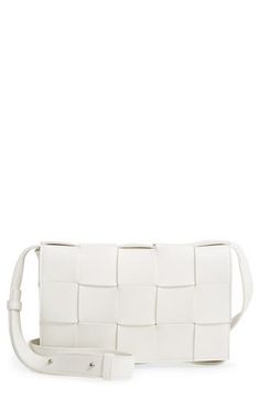 The brand's iconic intrecciato weave done on a larger scale defines a compact crossbody bag fashioned from supple nappa leather. The adjustable strap is detachable, letting convert the style to a chic clutch. Magnetic snap-flap closure Optional, adjustable crossbody strap Interior zip pocket Leather Made in Italy Designer Handbags Modern White Shoulder Bag With Intrecciato Weave, White Intrecciato Weave Crossbody Bag, Modern Crossbody Shoulder Bag With Intrecciato Weave, White Woven Leather Evening Shoulder Bag, Modern Intrecciato Weave Crossbody Shoulder Bag, Modern Intrecciato Weave Crossbody Bag, Modern White Woven Leather Shoulder Bag, Bottega Veneta Intrecciato, Woman Bags Handbags