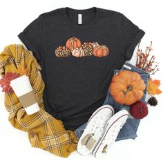 Get in the spirit of the fall with this simple Leopard Coquette Bow Pumpkin graphic tee. Perfect for fall, Thanksgiving, or a day at the pumpkin patch. This cute leopard pumpkin graphic T-shirt design is so adorable for your fall festivities! Our shirts are great for the fall season and would make a great gift.  Are you looking for your new favorite t-shirt? Our graphic tees are custom created specifically for you and made by me not sourced out to a print shop. Select your shirt style, color, an Graphic Cotton Tee For Fall, Fall Cotton Graphic Tee Shirt, Fall Relaxed Fit Graphic Tee, Bow Pumpkin, Retro Coquette, Hey Pumpkin, Pumpkin Graphic, Leopard Pumpkin, Coquette Bows