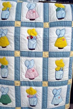 a blue and white quilt with many different items on it