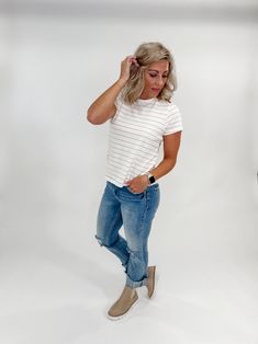 Get ready to elevate your everyday style with our Asher Crew Neck Striped Tee in Ivory Rose Stripe. With a relaxed fit and classic stripe design, this tee will quickly become a go-to in your wardrobe. Perfect for those days when you want to look effortlessly chic while staying comfortable. Length: 23.5" Sleeve Length 6.5" Crew Neckline Stunning Silhouette Relaxed Fit Colors May Vary From Different Viewing Devices Runs True to Size Amy is 5'4", 34B Wearing a Size Small Material and Care 100% Cott White Vertical Stripes T-shirt For Spring, Spring Relaxed Fit Vertical Stripes T-shirt, Relaxed Fit Vertical Stripes T-shirt For Spring, Casual Vertical Striped T-shirt For Spring, White T-shirt With Vertical Stripes For Spring, Relaxed Fit T-shirt With Vertical Stripes For Spring, Chic Striped T-shirt With Crew Neck, Casual T-shirt With Striped Hem For Spring, Casual T-shirt With Vertical Stripes For Spring