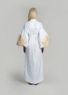 Luxurious White/Gold Kolossya Women's Midi Caftan Yuliya Magdych Elegant Cotton Kaftan For The Beach, Elegant Cotton Beach Kaftan, White Long Sleeve Kaftan With Woven Motifs, White Long-sleeve Kaftan With Woven Motifs, Elegant Cotton Kaftan For Spring, Elegant Spring Kaftan With Embroidered Sleeves, Elegant Cotton Kimono, Traditional Cotton Dress With Kimono Sleeves, White Cotton Dress With Kimono Sleeves