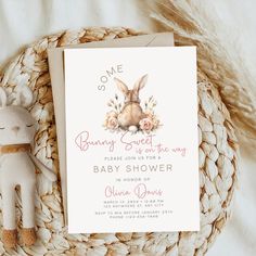 a baby shower with a bunny and flowers on it