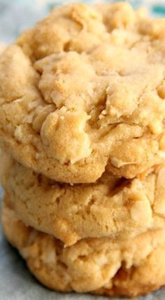 three cookies stacked on top of each other in front of a blue and white background