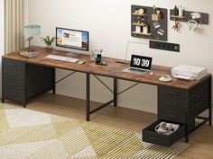 a desk with a computer, printer and other items on it