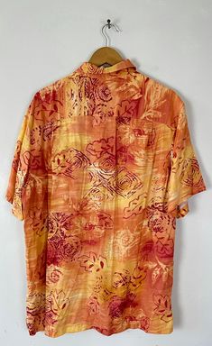 "-Description- >men's orange & red floral leaf print hawaiian shirt >collared >button front >open pocket on the front >size medium/large - marked a medium on tag but chest measurement is more like a large - please check measurements before purchase >so bold! >condition: great >color(s): orange, red >fabric(s): 100 rayon >brand: caribbean joe >care: machine wash -Measurements- >size: medium/large - marked a medium on tag but chest measurement is more like a Orange Short Sleeve Hawaiian Shirt For Spring, Orange Hawaiian Short-sleeve Top, Orange Relaxed Fit Hawaiian Shirt With Short Sleeves, Orange Collared Vacation Shirt, Orange Floral Print Shirt For Vacation, Orange Collared Shirt For Vacation, Orange Short Sleeve Hawaiian Shirt, Orange Collared Shirt With Floral Print, Orange Floral Print Collared Shirt