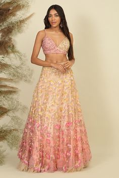 Baby pink woven lehenga with sequins, beads, pearls and crystals embroidery. Comes with a blouse and a dupatta.
Components: 3
Pattern: Woven, Embroidered
Type Of Work: Sequins, Beads, Pearls, Crystals
Neckline: V Neck
Sleeve Type: Sleeveless
Fabric: Net, Silk, Lining : Shantoon
Color: Pink
Other Details: 
Attached lining
Closure : Zip and hooks
Occasion: Bride,Wedding - Aza Fashions Festive Party Wear Lehenga With Floral Embroidery, Festive Party Wear Choli With Floral Embroidery, Festive Floral Embroidered Party Wear Choli, Festive Floral Embroidered Party Choli, Floor-length Floral Embroidered Party Choli, Party Floral Embroidered Floor-length Choli, Party Wear Choli With Floral Embroidery For Diwali, Party Wear Dupatta With Floral Embroidery For Diwali, Party Wear Floor-length Lehenga With Floral Embroidery