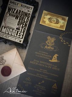 the harry potter wedding stationery is laid out next to an envelope and wax stamp