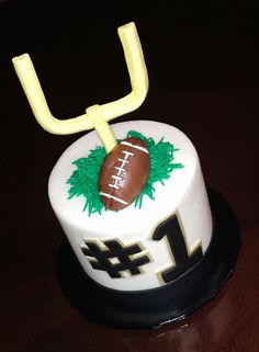 a cake with a football and number one on it