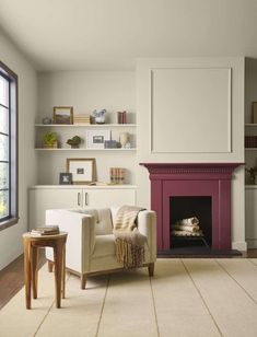 a living room filled with furniture and a fire place