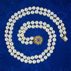 A classy vintage pearl matinee necklace from the late 20th Century displaying two strands of luxurious, creamy-white cultured pearls that are exceptionally bright with a smooth glossy surface.     Pearls are the birthstone of June and a true treasure of the ocean, produced organically by fresh and saltwater molluscs. Their spherical shape and exceptional lustre have long been associated with the beauty of the moon and are symbolic of purity, serenity, and loyalty.   The strands are held securely Formal Double Strand Pearl Necklace With Pendant, Vintage Akoya Pearl Necklace For Formal Occasions, Double Strand Pearl Necklace For Formal Occasions, Classic Pearl Necklace With 17 Jewels For Wedding, Formal Double Strand Pearl Necklace, Classic Double Strand Pearl Pendant Jewelry, Classic Double Strand Pearl White Necklace, Classic Double Strand Pearl Pendant Necklace, Classic Double Strand Pearl Necklace With Pendant