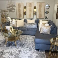 a living room filled with lots of furniture and pillows on top of a blue couch