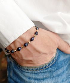 Mens pearl bracelet, Gold beaded hematite y2k black pearl bracelet, Boyfriend gift ideas, Surfer crystal bracelet, Real black pearl bracelet men An unreal beauty bracelet made of black pearls will definitely make you or your boyfriend happy! The deep blue shade of pearls will play its color in the sun. I only use natural freshwater pearls so I don't have perfect identical round beads like plastic ones. Each pearl, like a person, is unique, with its own life story, each bead has its own stripes - Pearl Bracelet Men, Boyfriend Gift Ideas, Bracelet Boyfriend, Black Pearl Bracelet, Pearl Bracelet Gold, Men's Bracelets, Bracelet Men, Y2k Black, Crystal Bracelet