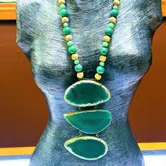 Fabulous Statement Necklace If You Feel You Can Pull Off An Iris Apfel! The Necklace Itself Consists Of Brass Beads In A Swirl Pattern Alternating With Two Sizes And Hues Of Dyed Jade Beads. The Necklace Suspends A 3-Piece Drop Of Dyed Green Chalcedony. Necklace Is 18" Length. Drop Is 5 1/2" Additional. Unique Green Agate Necklaces, Unique Green Natural Stone Necklace, Artisan Green Stone Necklaces, Adjustable Green Stone Necklace, Green Long Necklace With Natural Stones, Green Agate Long Necklace, Artisan Green Stone Necklace, Green Natural Stones Long Necklace, Long Green Necklace With Natural Stones