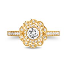 a yellow gold engagement ring with an intricate flower design and round brilliant cut diamonds on the band