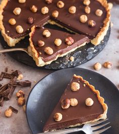 there is a chocolate pie with nuts on it