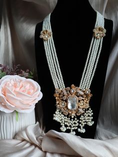 ✨ Stunning Eastern Elegance ✨ Indulge in luxury with our handcrafted statement necklace and earrings set, adorned with lustrous pearls and intricate gold detailing. Perfect for those special occasions where you want to stand out with timeless beauty and grace. ✨ 💎 This set features: Multi-strand pearl necklace Dazzling crystal centerpieces Intricate gold floral accents Matching opulent earrings Limited stock available!  . . . . Email : Houseofjavahir@gmail.com 🛒 Visit us at https://houseofjavahir.etsy.com 📩 DM for inquiries and orders! Opulent Bridal Necklace With Intricate Design For Festive Occasion, Opulent White Jewelry For Wedding, Opulent Bridal Necklace For Festive Wedding, Elegant Kundan Bridal Necklace With Pearl Chain, Heavy Temple Jewelry Pearl Bridal Necklace, Heavy Temple Jewelry Bridal Pearl Necklace, Intricate Pearl Necklace For Celebrations, Festive Pearl Chain Necklace For Reception, Festive Bridal Necklace With Intricate Pearl Design