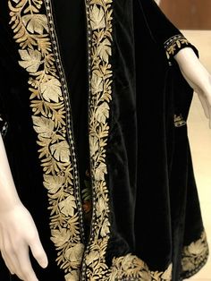 Complement your outfit with this Royal Velvet Cape. This is a very easy to style cape and it can be paired with any top, blouse, dress, or any other thing, no doubt you'll stand out from the crowd.Product DetailsCondition Brand New Velvet Cape with Golden & Silver Kashmiri Zari Embroidery.Colour: BlackSize: 82" X 35" (208.28 cms X 88.9 cms) approx.If you want a bigger or smaller size (dimensions), we can make it for you on order, just drop us a message.Care Instructions- Dry Clean Only.✿Subscrib Black Kaftan With Dupatta, Designer Black Kaftan With Resham Embroidery, Black Kaftan With Resham Embroidery Traditional Drape, Traditional Black Designer Kaftan, Designer Embroidered Black Kaftan, Designer Black Embroidered Kaftan, Black Traditional Wear With Embroidered Border For Ceremonial Occasion, Traditional Embroidered Formal Dupatta, Elegant Black Kaftan With Chikankari Embroidery