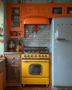 an old fashioned kitchen with orange cabinets and appliances in the center, including a yellow stove top oven