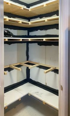 the inside of a closet with some shelves in it