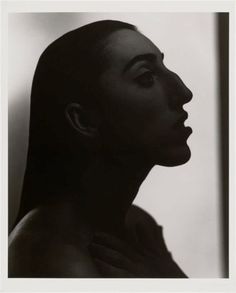 a black and white photo of a woman's profile