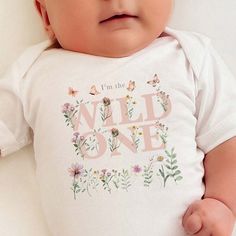 To order MULTIPLE SHIRTS, add to cart ONE at a time. Celebrate your little one's special day with our enchanting Wildflower Birthday Shirt Wildflower Family Shirts collection. For a Boho Girls Tee with a touch of whimsy, our Boho Girls Tee Wildflower and Boho Wildflower Birthday Family Shirts are perfect. Dress your little girl in a Boho Wild One Wildflower 1st Birthday Girl Shirts for Family or a Butterfly Wildflower Toddler T-shirt. The Cottagecore inspired collection includes the First Birthd Pink Onesie For Birthday In Spring, White Onesie For Summer Gift, White Onesie As Summer Gift, Summer Birthday Onesie With Short Sleeves, Summer Gift White Onesie, Family Matching Onesie For Birthday In Summer, Family Matching Summer Birthday Onesie, Playful Summer Onesie For Gift, Playful Summer Onesie For Gifts