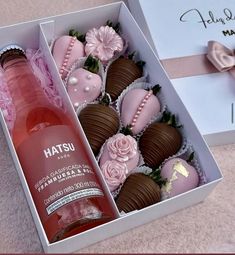 a bottle of wine and some chocolates in a box