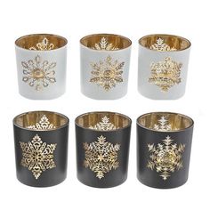 six black and white cups with gold snowflakes on them