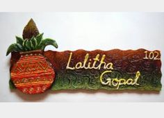 a wooden sign that says, lolliha good with a potted plant on it