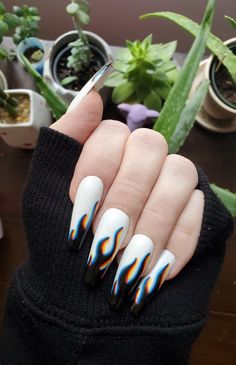 These eye-catching, optical illusion nails are made to look like an out of focus, 3-D version of the popular flame design. Each nail set includes 10 hand painted, press on nails and a nail prep kit (tube of nail glue, cuticle pusher, file/buffer) Lauren is wearing 'Long coffin' in medium. For help with sizing, please use our sizing guide. Halloween Nail Ideas, Flame Nail Art, Nail Art Halloween, Nagellack Trends, Halloween Nail Designs, Halloween Nail, Halloween Nail Art, Fire Nails