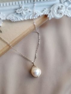 Minimal jewellery set with earrings and necklace ✨ This simple set is made with freshwater pearls and a choice of sterling silver, 14k gold filled or rose gold filled.• Pearl Size: Earrings 7 mm/ Necklace 9-10 mm• Earrings Drop Length: approx. 2 cm• 14K gold-filled & sterling silver wire is known for its lasting quality. The jewelry won’t tarnish or turn color. You can wear them every day!• Hypoallergenic. You won’t have to worry about allergies from metal such as nickel.✨ The earrings will be p Fine Jewelry Pearl Necklace As Gift, Elegant Gold Wire Wrapped Jewelry, Elegant Hypoallergenic Round Pendant Jewelry, Pearl White Jewelry With Pearl Charm For Jewelry Making, Fine Jewelry Pearl Necklace With Pearl Chain As Gift, Graceful Pearl Chain Jewelry Gift, Graceful Pearl Pendant Jewelry As A Gift, Sterling Silver Pendant With Pearl Charm, Elegant Hypoallergenic Round Pendant Necklace