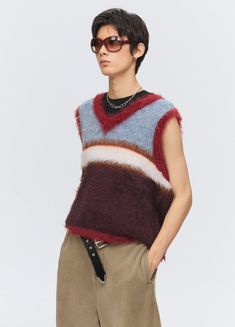 Versatile Fuzz Knit Sweater Vest – Embrace comfort and style with this fuzzy wool sweater vest. Featuring clashing contrast color tones, this boxy and cropped fit vest is crafted with knitted wool and alpaca wool, making it lightweight and perfect for layering. Ideal for both men and women, this unisex piece comes in sizes Small, Medium, and Large, and is available in stunning Red/Black. Size Chart: SIZE (CM) LENGTH SHOULDER CHEST SMALL 54 38 92 MEDIUM 57 40 98 LARGE 60 42 104 Striped Vests, Knit Sweater Vest, Angel Dress, Velvet Color, Color Rojo, Alpaca Wool, Knit Vest, Color Stripes, Cardigan Jacket