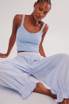 All you need for the sweetest sleep: this essential set from Intimately features a darling ribbed tank with our fav Cloud Nine searsucker bottoms in a jogger style for a put-together look that dreams are made of. **Fit:** Fitted top, relaxed, low-rise bottoms **Features:** Top: Soft ribbed fabrication, scoop neckline, full length, rose applique; Bottoms: Searsucker fabrication, elastic waistband, front patch pocket, ruched leg opening, drop-crotch silhouette **Why We | Cloud Nine Pajama Set by Intimately at Free People in Blue, Size: L Cute Sweats, Embroidered Pajamas, Cute Lounge, Cotton Pajamas Women, Cute Pajama Sets, Comfy Sets, Rose Applique, Lounge Outfit, Cloud Nine